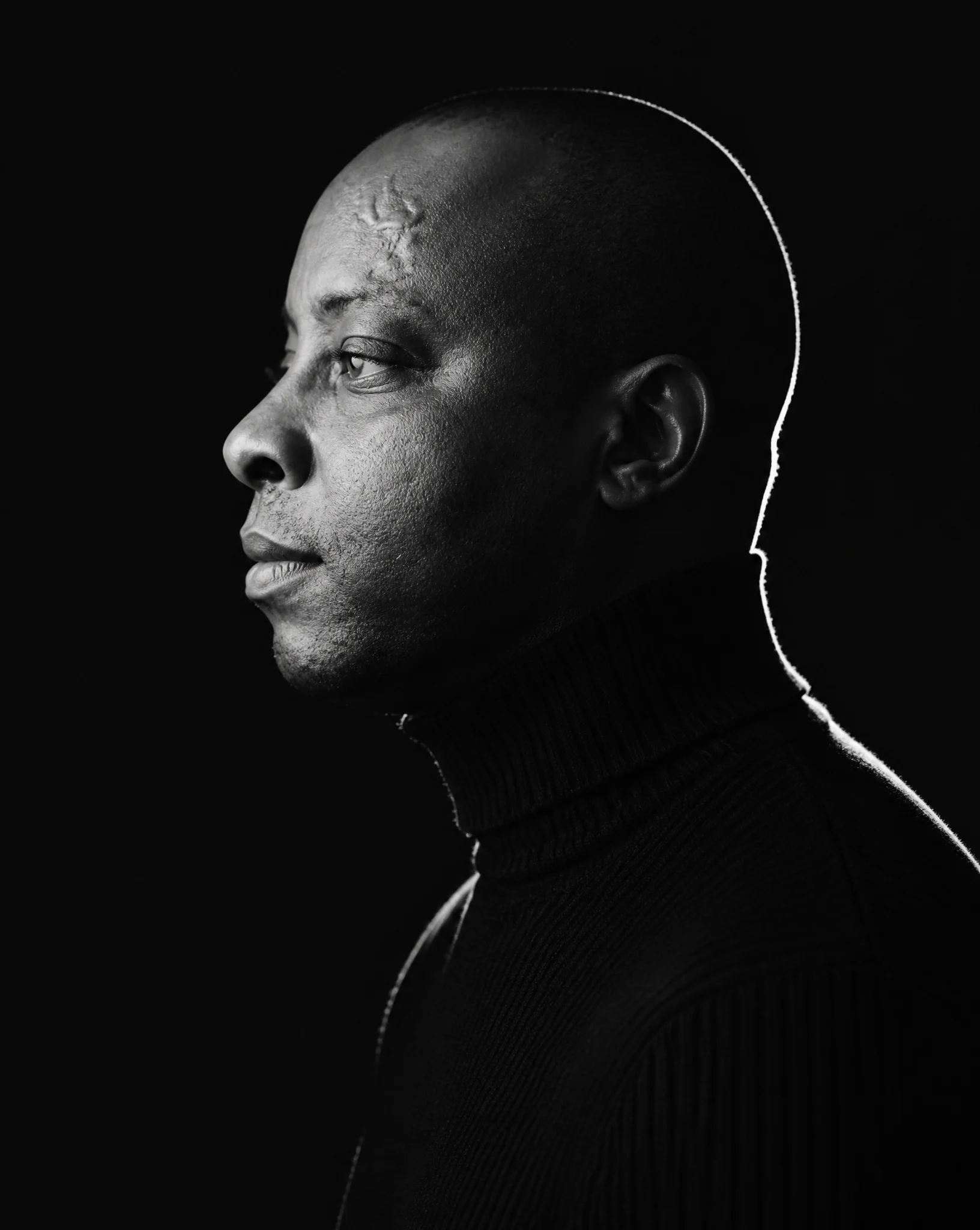 A minimalist black and white cinematic portrait featuring...